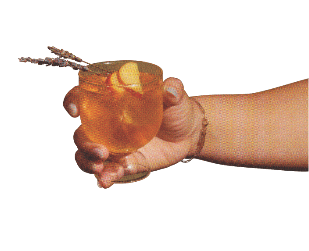 hand holding old fashioned glass
